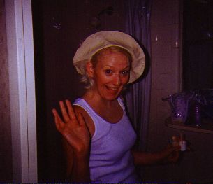 Kelly was putting on her make-up & to get her hair out of the way, put on a hat that made her look like Little Debbie.