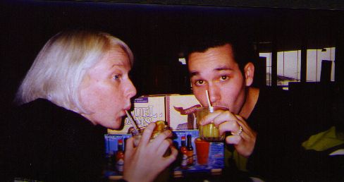 Kelly & James toast their trip with screwdrivers.